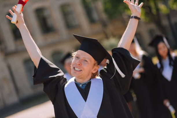 istock Happy boy raising his hands in the air. 1166043474