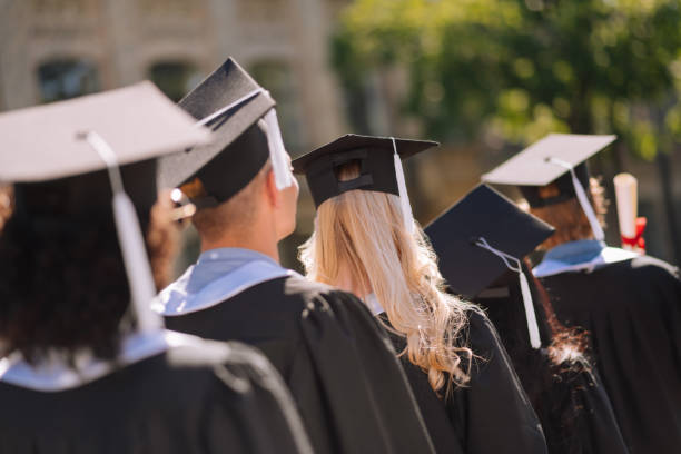 istock Graduates going away after receiving masters degree. 1166043475