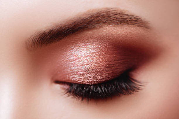 istock Female Eye with Extreme Long False Eyelashes. Eyelash Extensions. 1166044235