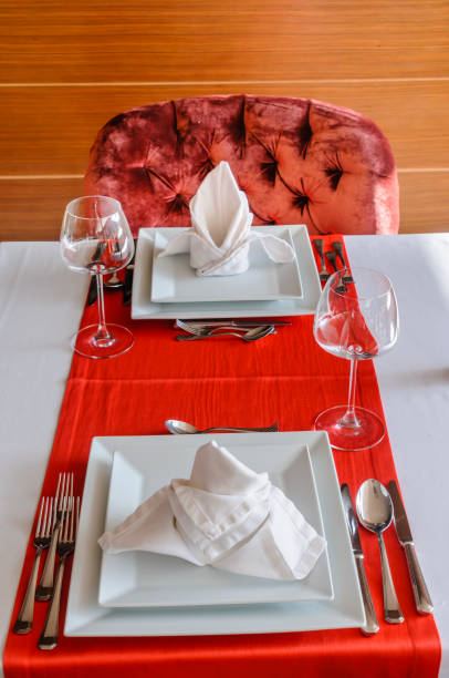 istock Folded napkin and place settings in a fine dining restaurant 1166045293
