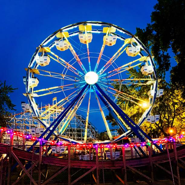 istock Evening view of Ferris wheel lights 1166045572