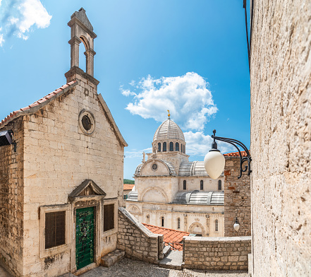 view on cathedral of St James in Sibenik against blue summer sky