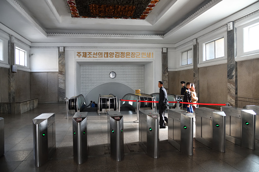 Pyongyang, North Korea - May 1, 2019: People at the entrance of the Puhung subway station in Pyongyang Metro