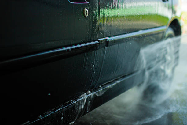 istock Modern car wash, dripping water and foam. 1166047583