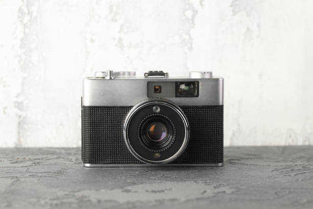 istock The vintage rangefinder automatic film camera on grey cement background. 1166048432