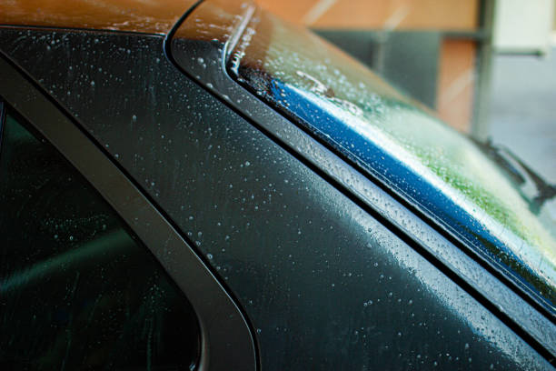 istock Modern car wash, dripping water and foam. 1166048445