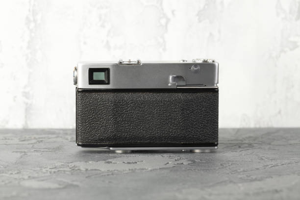 istock The vintage rangefinder automatic film camera on grey cement background. 1166048456