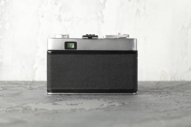 istock The vintage rangefinder automatic film camera on grey cement background. 1166048519