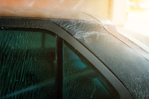 istock Modern car wash, dripping water and foam. 1166049612