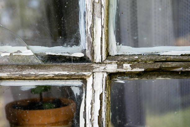 istock Old window pane with peeled of white colour 1166051063