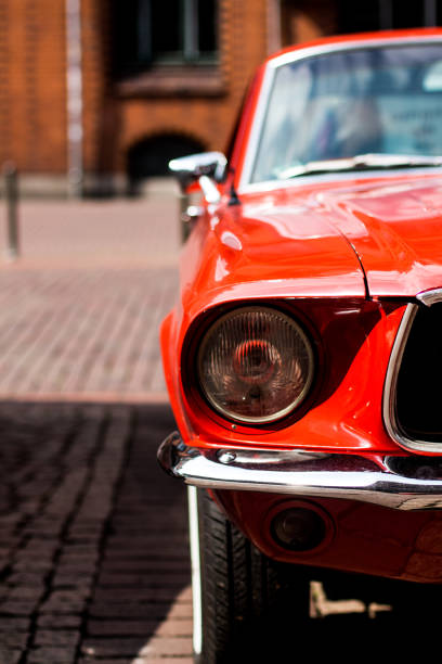 istock Closeup of a red classic mustang car 1166051278