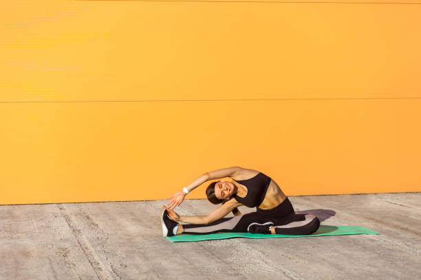 istock Young woman practicing yoga, doing revolved head to knee forward exercise, parivrtta janu sirsasana pose, 1166052576