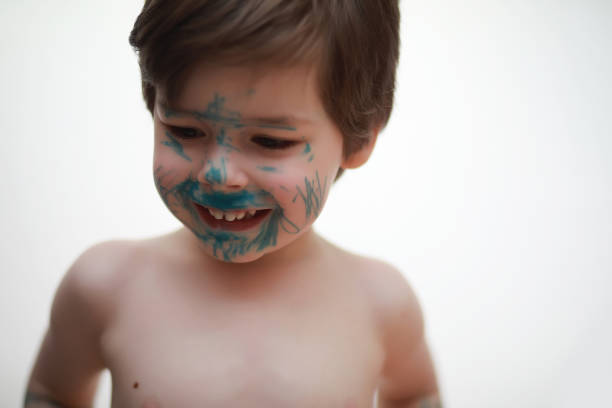 istock A child painted his face with colors 1166056180