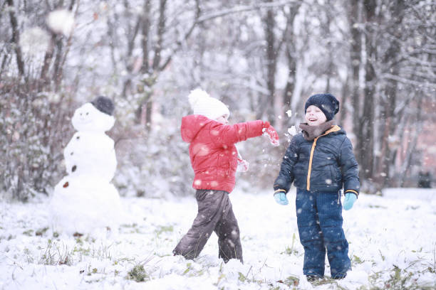 istock Kids walk in the park first snow 1166056204