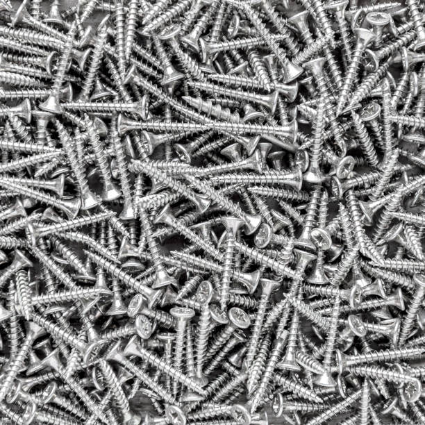 Black and white metal screws background and texture