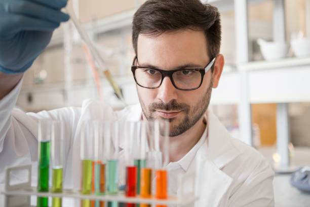 istock Bio-technologist testing new chemical substances in a laboratory with test tubes 1166070743
