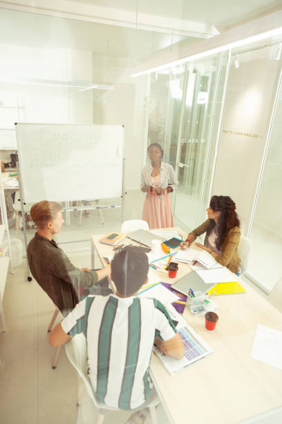 istock Group of international students participating in grammar discussion 1166070898
