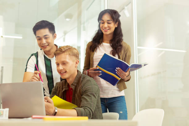 istock Handsome young blonde man staring at his laptop 1166070920