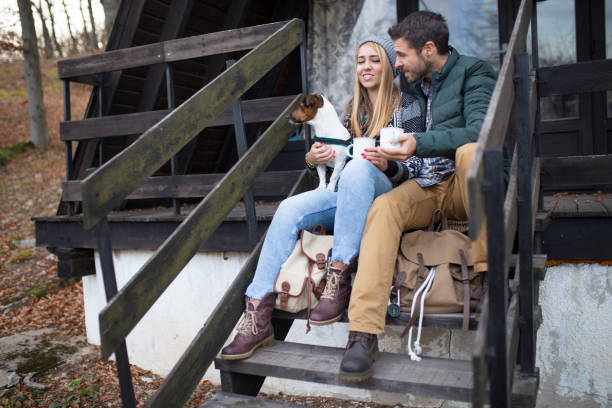 istock Cute Couple On Camping With Their Dog 1166072936