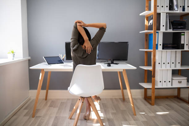istock Businesswoman Stretching Her Arms 1166079144