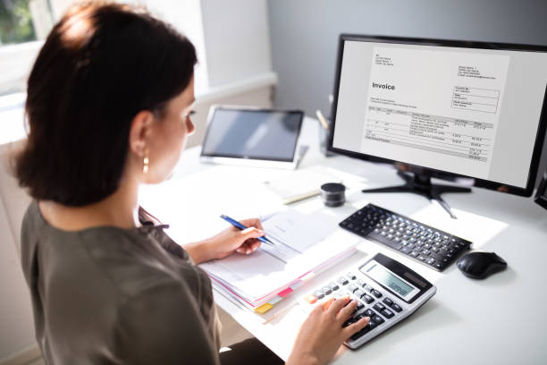 istock Accountant calculating tax at desk 1166079154