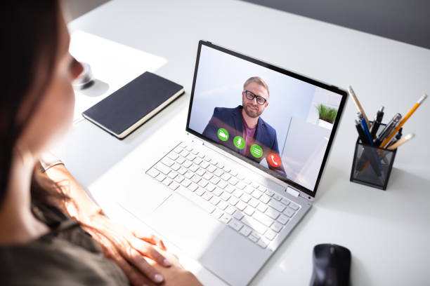 istock Businesswoman Video Conferencing With Coworker 1166079157