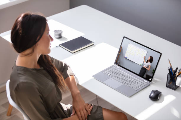 istock Woman Participating In Online Coaching Session 1166079164