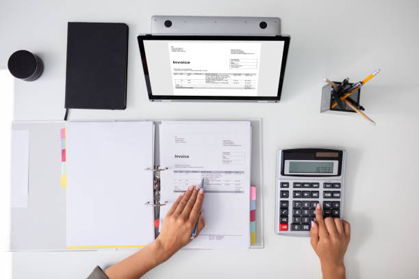 istock Accountant calculating tax at desk 1166079174