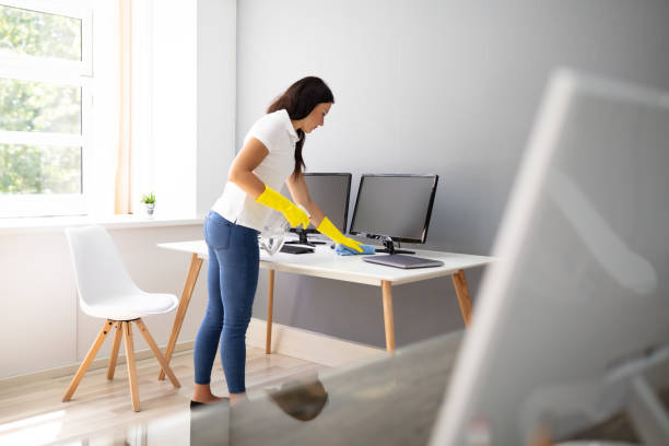 istock Janitor Cleaning Desk With Napkin 1166079179