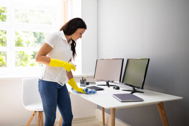 istock Janitor Cleaning Desk With Napkin 1166079194
