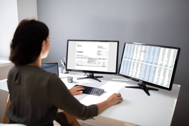 istock Businesswoman Calculating Invoice On Computer 1166079308
