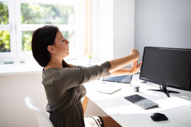 istock Businesswoman Stretching Her Arms 1166079587