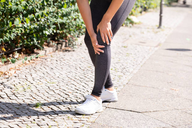 istock Jogger Having Pain In Her Knee 1166079643