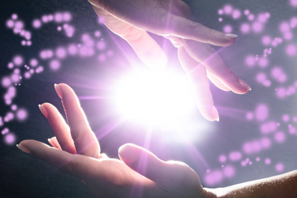 Mysterious Power In The Hands Close-up Of Mysterious Glowing Power In The Hands reiki photos stock pictures, royalty-free photos & images