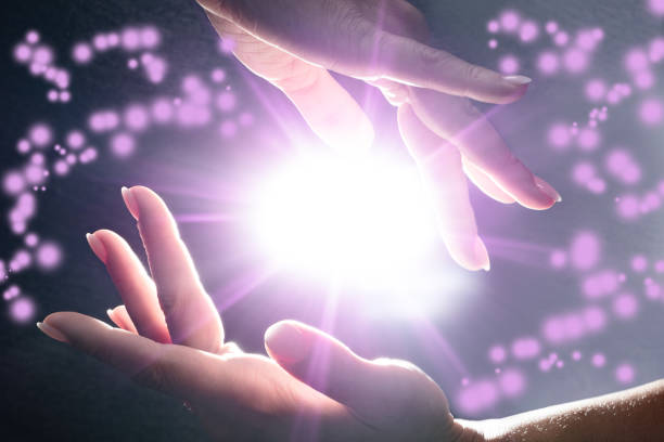 Mysterious Power In The Hands Close-up Of Mysterious Glowing Power In The Hands reiki stock pictures, royalty-free photos & images