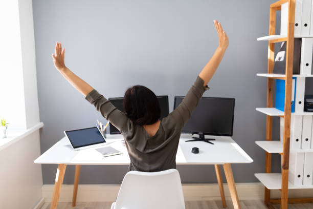 istock Businesswoman Stretching Her Arms 1166079702