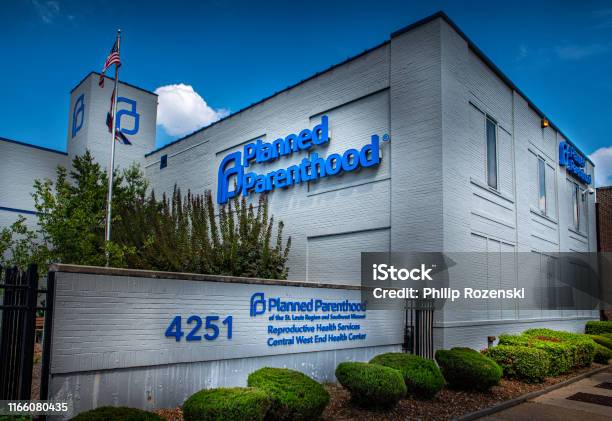 Signs For Planned Parenthood A Womens Health Provider Displayed On The Side Of A Facility In Central Westend Stock Photo - Download Image Now