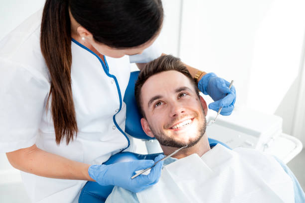 istock Man having teeth examined at dentists 1166082517