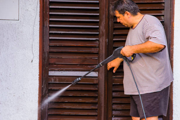 istock Man Cleaning House with Water Spray 1166086516