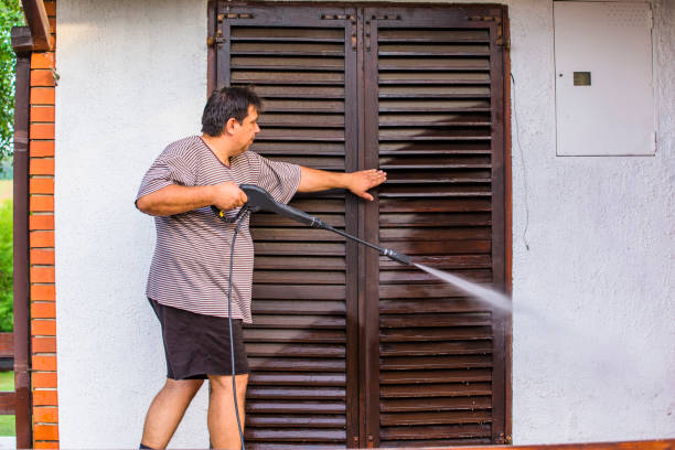 istock Man Cleaning House with Water Spray 1166086520
