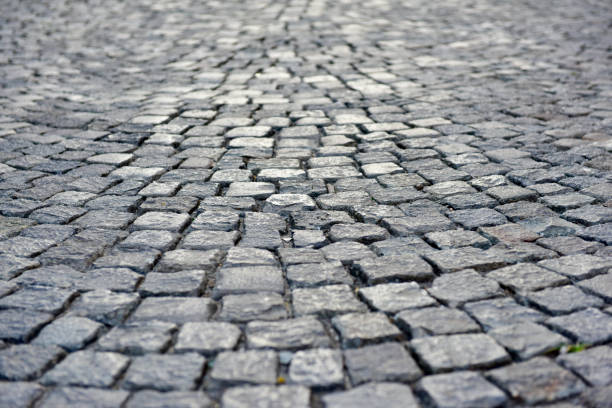 istock Texture of old stone street 1166089332