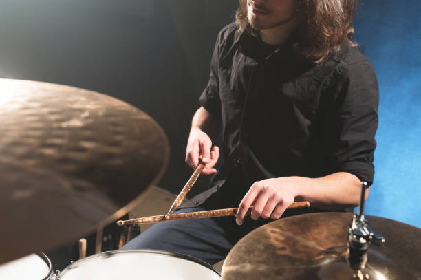 istock Close-up of a male drummer's hand holding drum sticks 1166089540