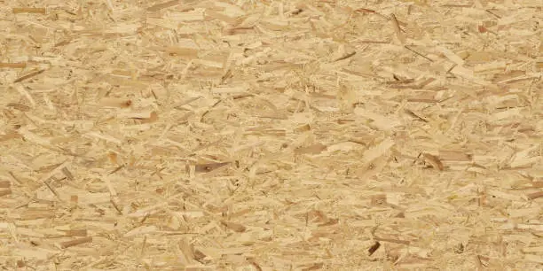 Photo of Full frame image of oriented strand board (OSB). High resolution seamless texture