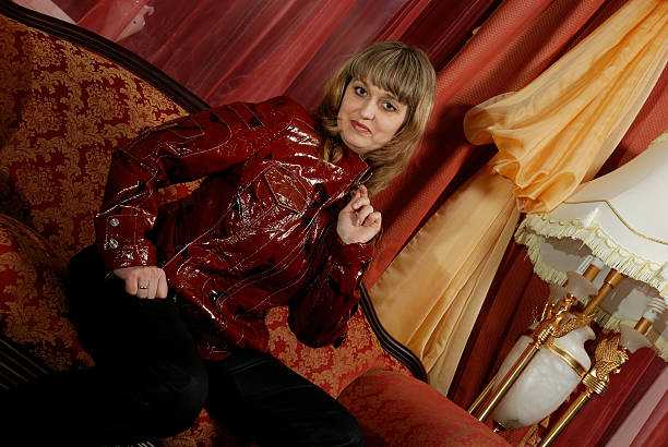 istock woman in a leather, lacquered jacket 116609113