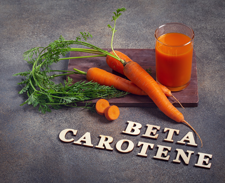 Beta carotene text and carrot juice