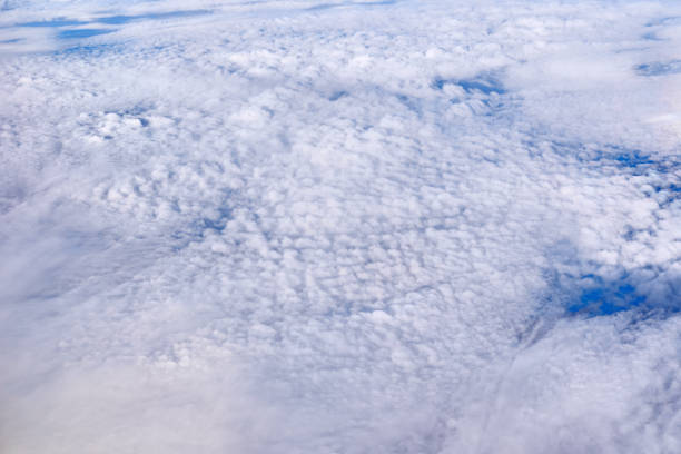 istock Blue sky above the clouds from airplane window 1166092456