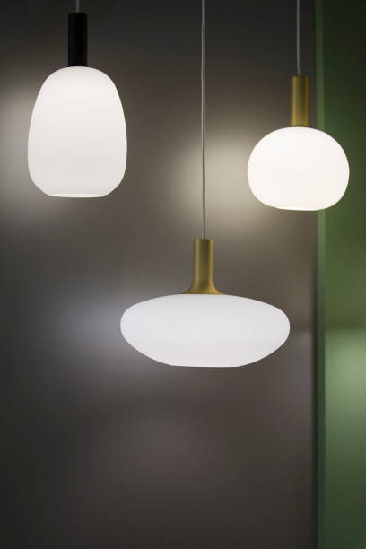 istock Three different-shaped chandeliers, matte white pendant lights. Design minimalistic white chandeliers oval and round on grey background 1166092565