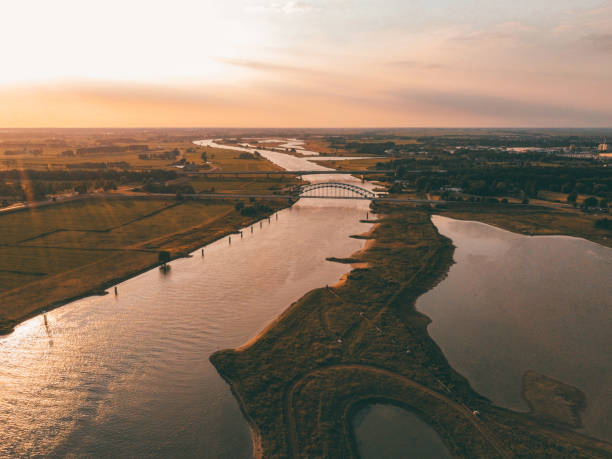 Sunset on the river Sunset view on a river in The Netherlands  Juli 22, 2019 netherlands aerial stock pictures, royalty-free photos & images