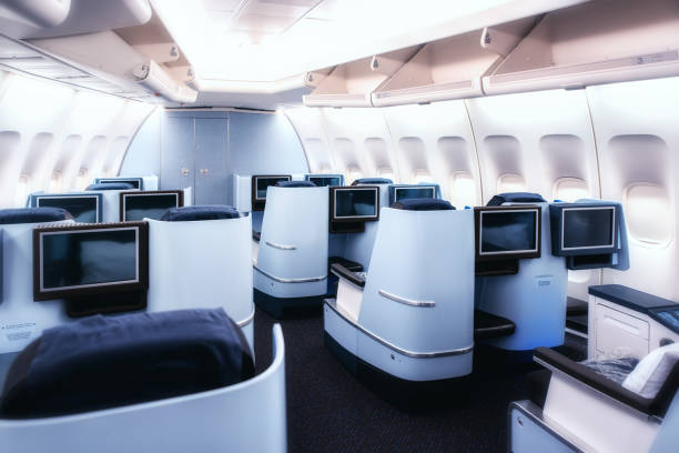 istock Airplane cabin business class interior view 1166093435