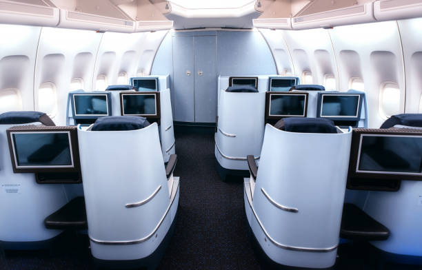 istock Airplane cabin business class interior view 1166093437
